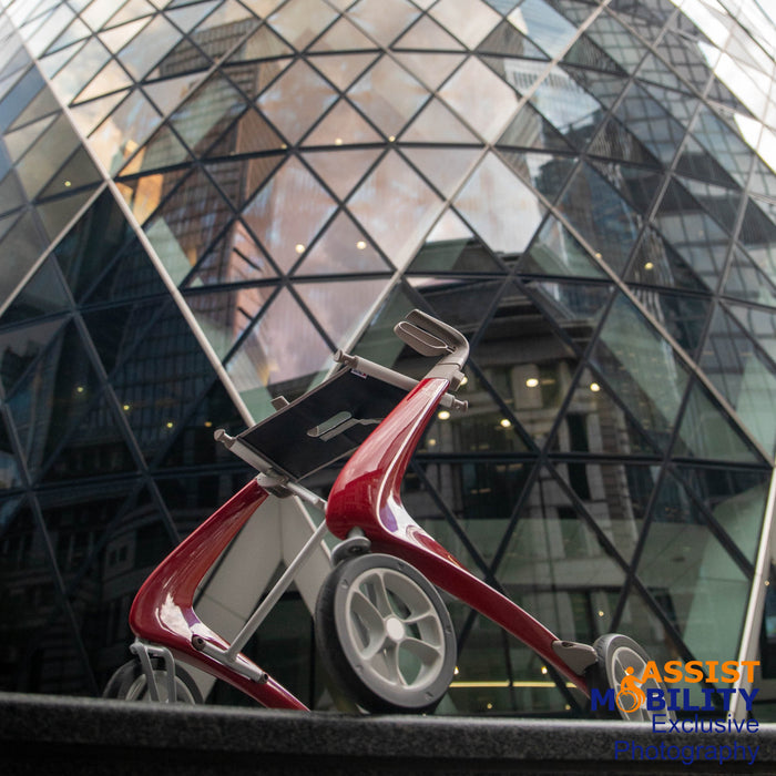 byACRE Red Ultralight Rollator next to the Gherkin in London