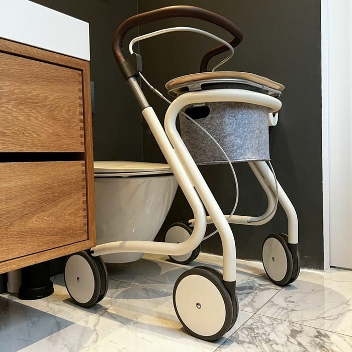 The scandinavian Butler indoor rollator from byACRE. in the bathroom.,  A handy and adaptable rollator disability aid for around the home..