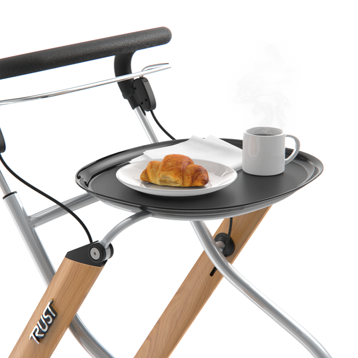Trust Care Lets Go rollator with a cup of tea and croissant on tray showing curved edges to hold contents