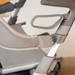 Outside view of the padded backrest on the byACRE Carbon Ultralight rollator, showing the fabric strap wrapped around the frame