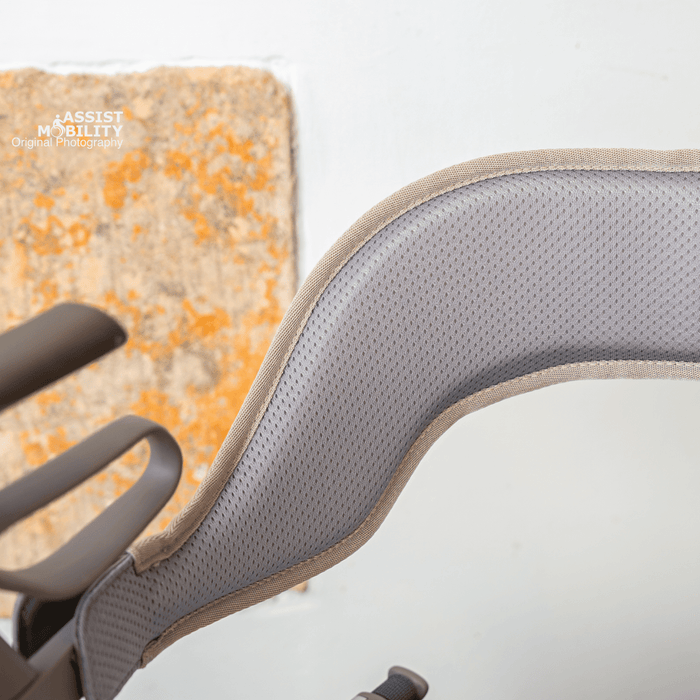 The padded backrest for the byACRE Carbon Ultralight rollator seen from behind, showing its curved shape and breathable mesh