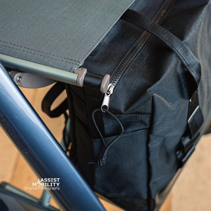 Close-up of the zip and pull cord on the byACRE Daypack bag, fitted under the seat of a byACRE Carbon Overland rollator