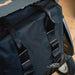 Close-up of the carry handles and webbing loops on the black byACRE Daypack bag, fitted to a byACRE rollator