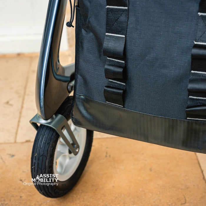 Front-on close-up of the byACRE Daypack bag on a byACRE rollator, showing its webbing straps and durable base