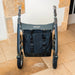 Front view of the byACRE Daypack bag fitted centrally under the seat of a byACRE Carbon Overland rollator