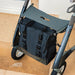 Looking down on the black byACRE Daypack bag attached beneath the seat of a byACRE Carbon Overland rollator