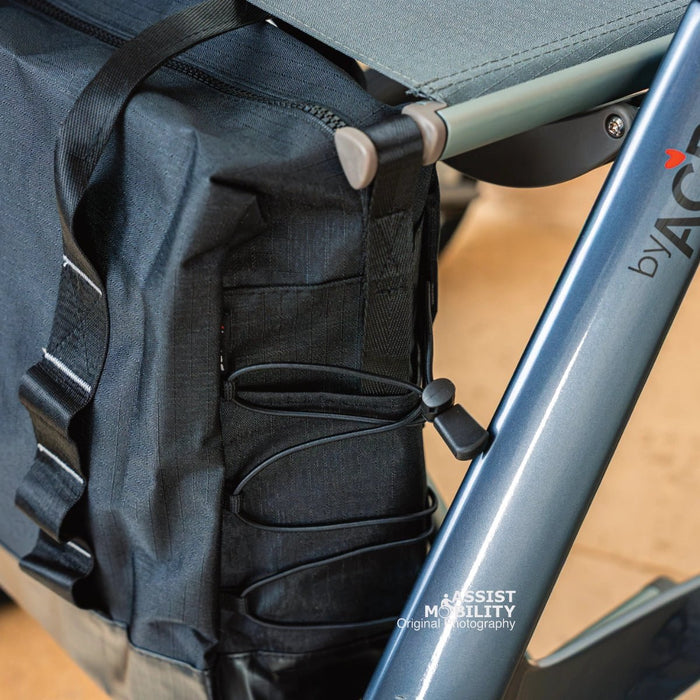 Close-up of the byACRE Daypack bag hanging from a byACRE rollator, showing its straps and elastic side cord