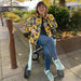 Melissa sitting on her byACRE Nordic Pioneer rollator in Glacier Green