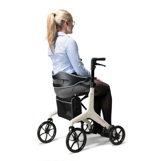 Lady sitting in the Drive AeroWalk Rollator 