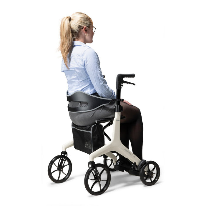 Lady sitting in the Drive AeroWalk Rollator 