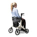 Lady sitting in the Drive AeroWalk Rollator 