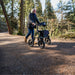 Man walking through the woods with Torrow rollator