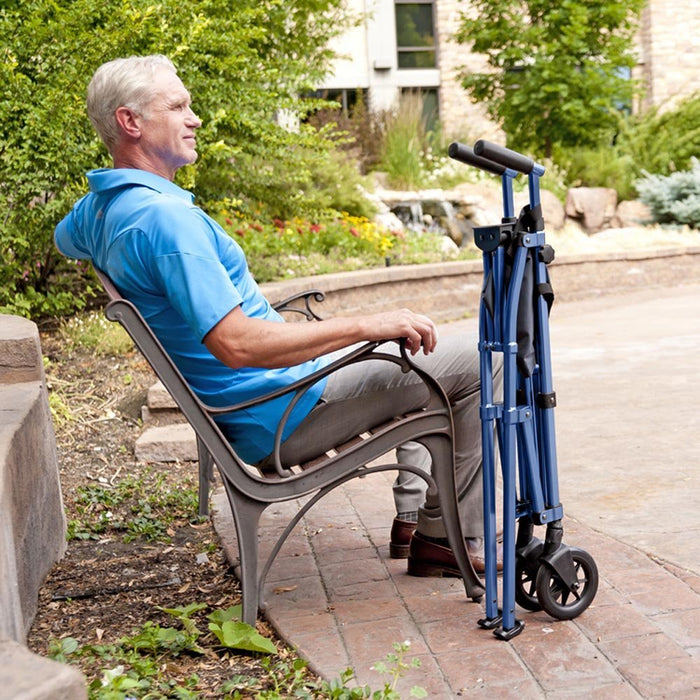 Gentleman resting on a bench with his Ez standing folded neatly by his side