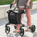 Lady walking with the Gemini 30 SpeedControll rollator which is ideal for slowing down