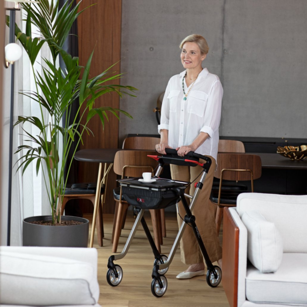 Rehasense Space I indoor rollator being used by a lady