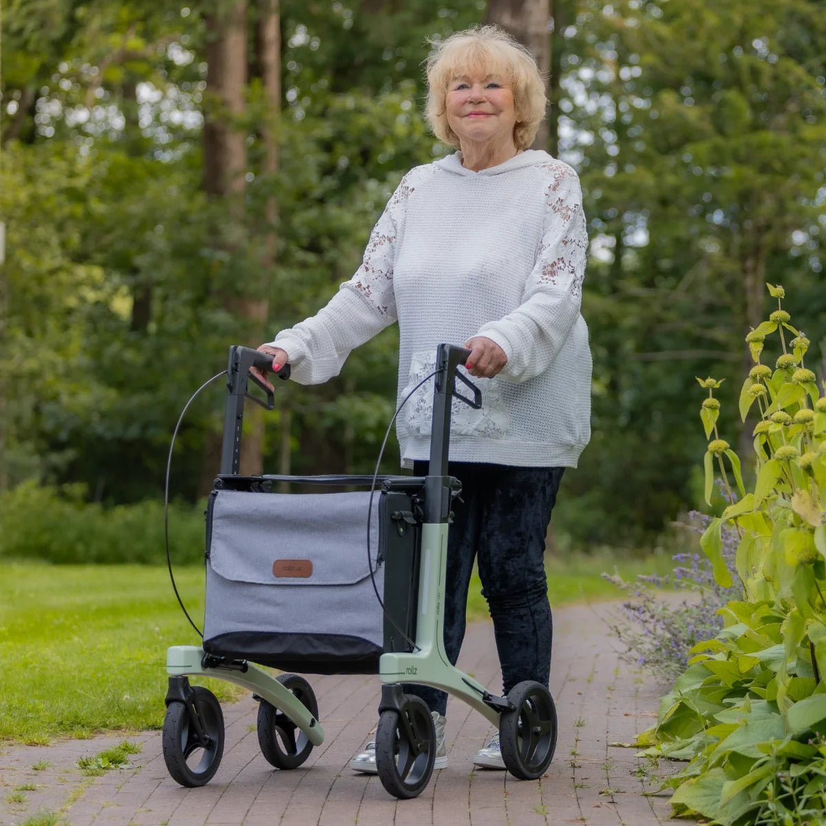 Lady using Rollz Air Rollator in Mint Green
