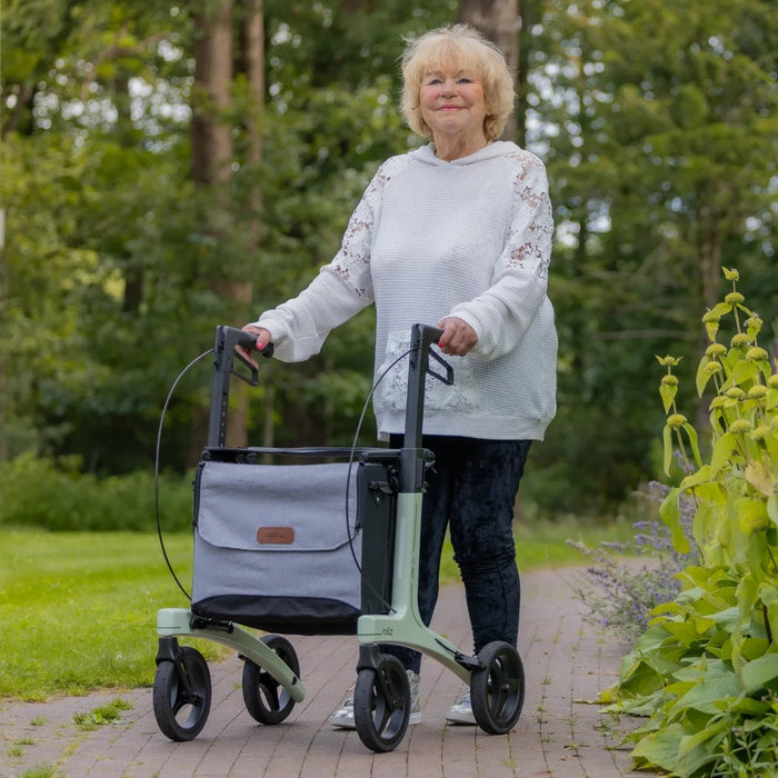 Lady using Rollz Air Rollator in Mint Green