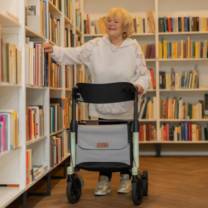 Lady pushing the Rollz Air Rollator in Mint Green
