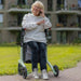 Lady seated in the Rollz Air Rollator in Mint Green