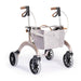 Saljol Carbon Superlight rollator in Rose Gold with a light grey mesh shopping bag and tan handles, on a white background