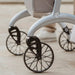 Close-up of the spoked wheels and curved frame with Saljol logo on the Saljol Carbon Superlight rollator