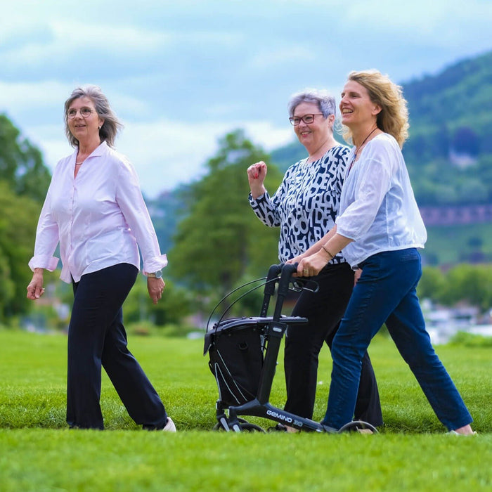 GEMINO 30 Carbon fibre rollator being used for everyday activities such as walk in the park