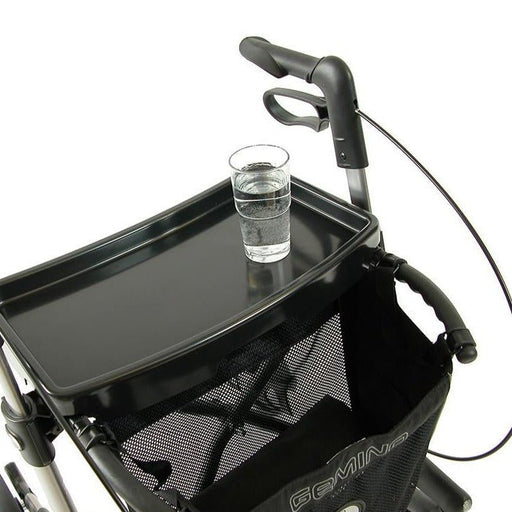 Sunrise Medical rollator tray with a glass sitting perfectly on the tray for easy transportation