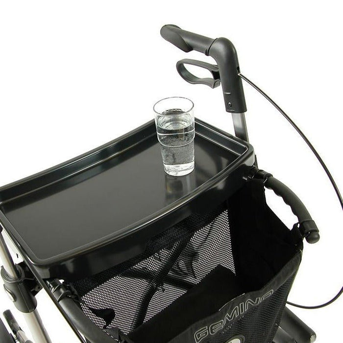 Sunrise Medical rollator tray with a glass sitting perfectly on the tray for easy transportation