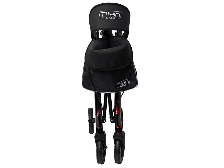 Titan carbon rollator folded with bag attached at Assist Mobility