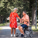 Couple resting with the Olympos ATR rollator by Topro.
