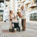 Two people chatting with the Topro Original Classic Rollator