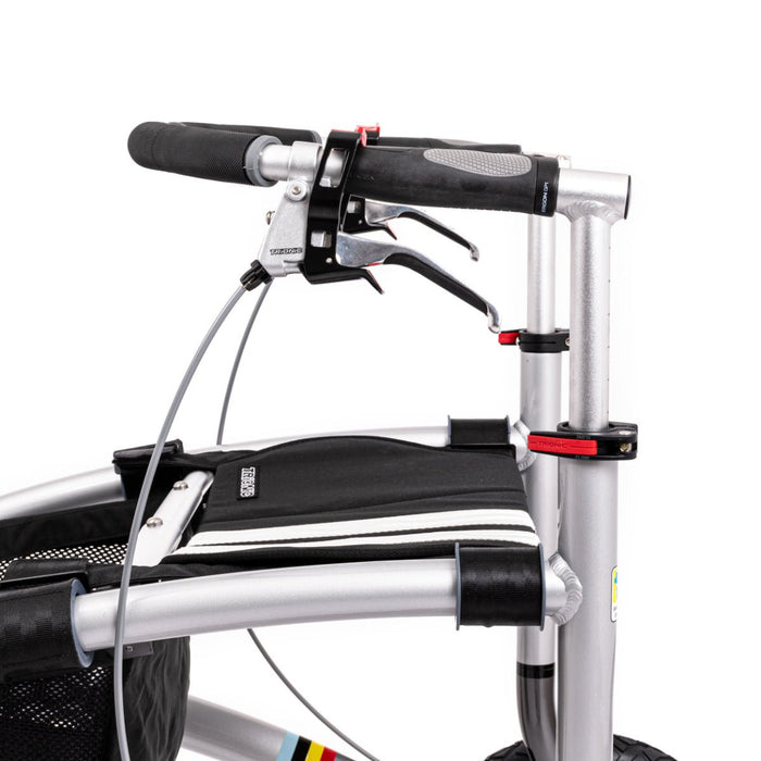 Close-up of a Trionic Walker handlebar with black grips and silver frame on a white background