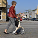 Lady walking confidently with her Lets Fly rollator.