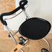 A close-up of a Trust Care Let's Go Indoor rollator with a black seat, black handle, and a silver metal frame, positioned against a beige stone and white wall background.