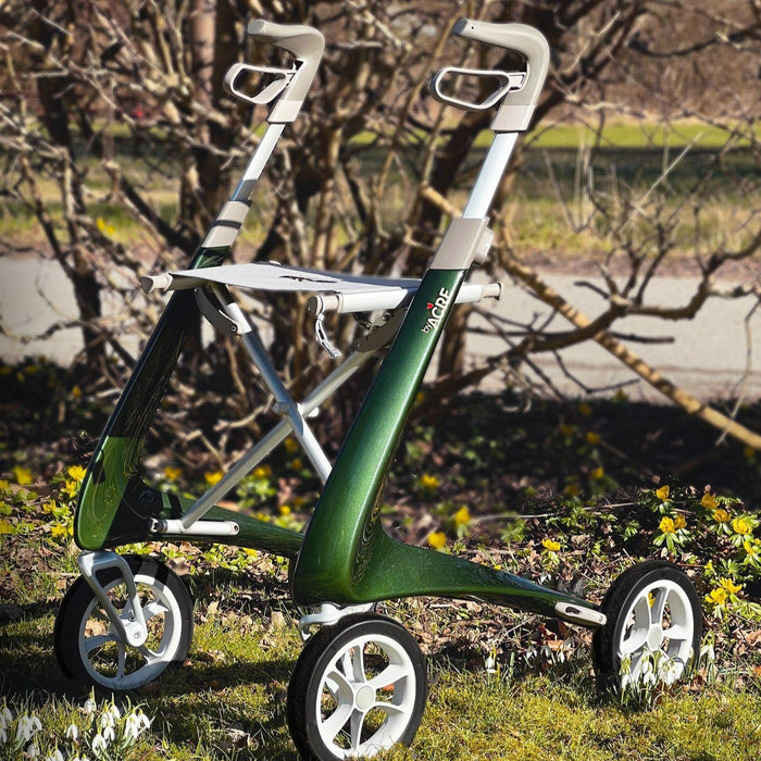 British Racing Green Ultraligh rollator in the spring sunshine with snowdrops